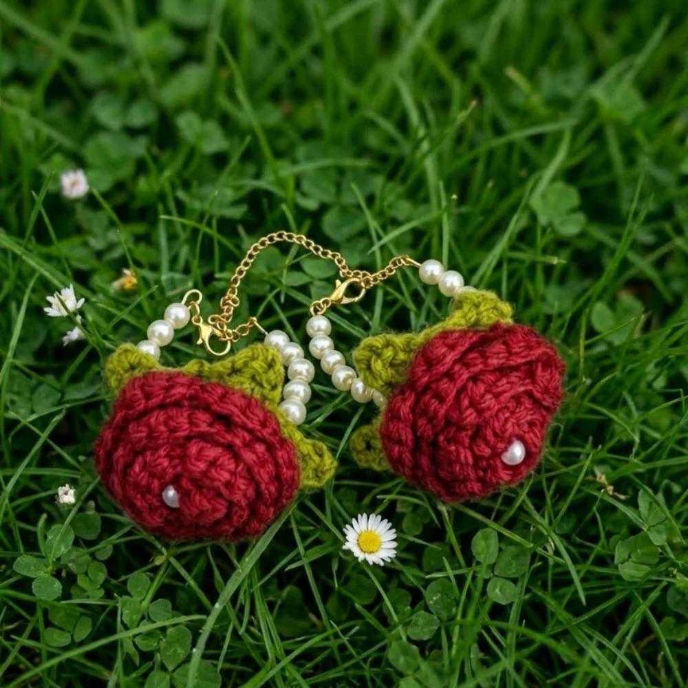 Crochet red baby gajry, traditional handmade baby wrist flower accessory in Pakistan