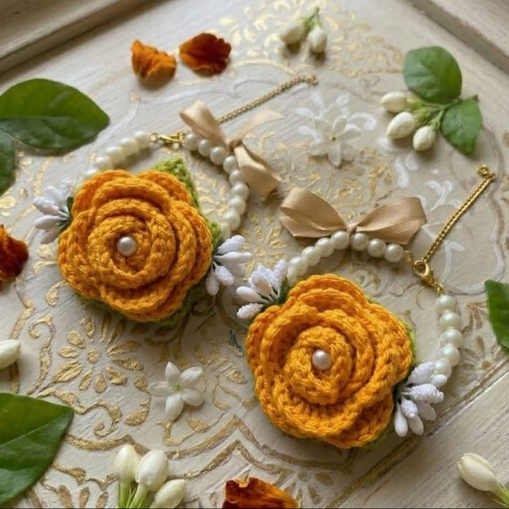 Orange crochet gajra with detailed flower design