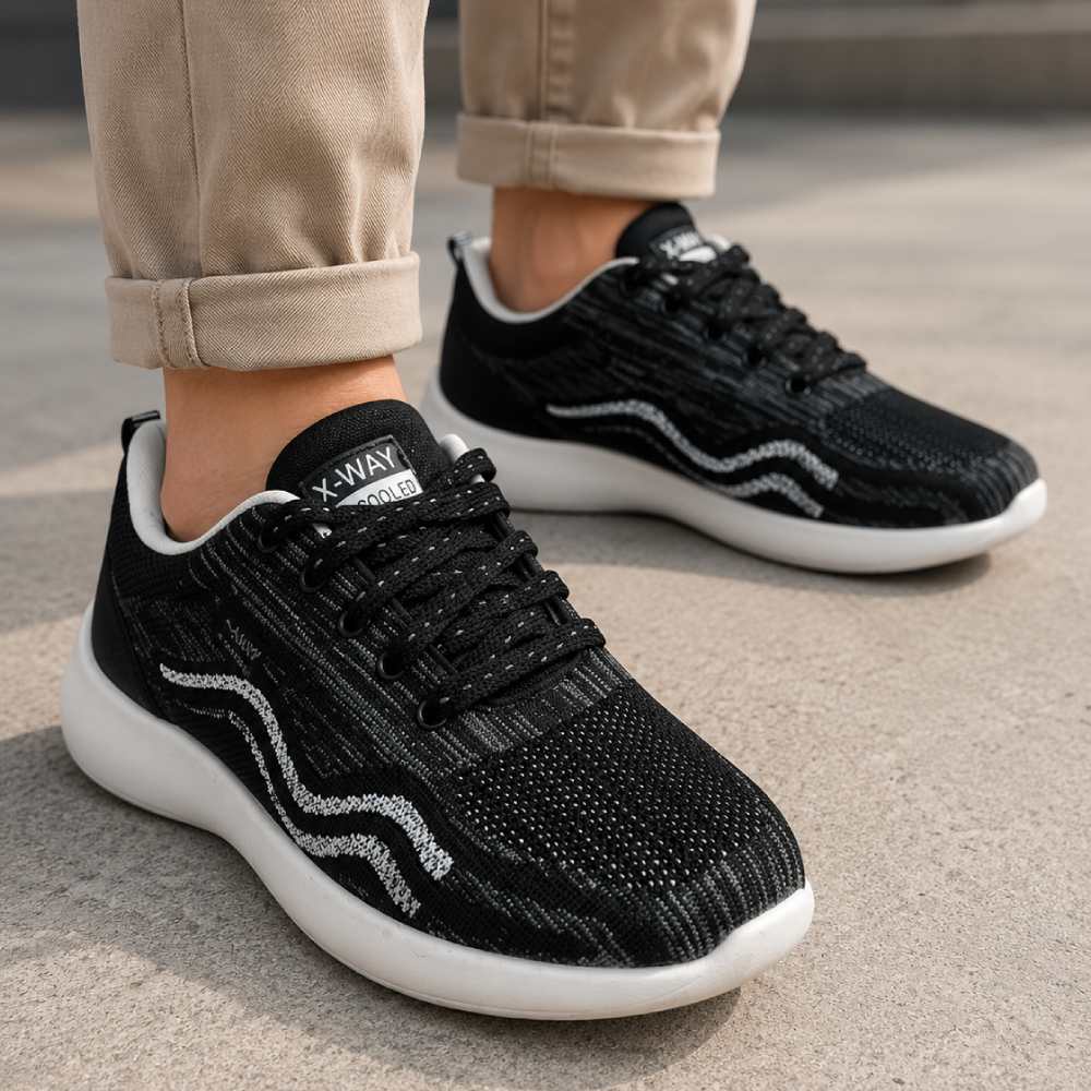 Comfortable black white sports sneakers for men featuring breathable fabric, soft insole, and flexible lightweight sole.
