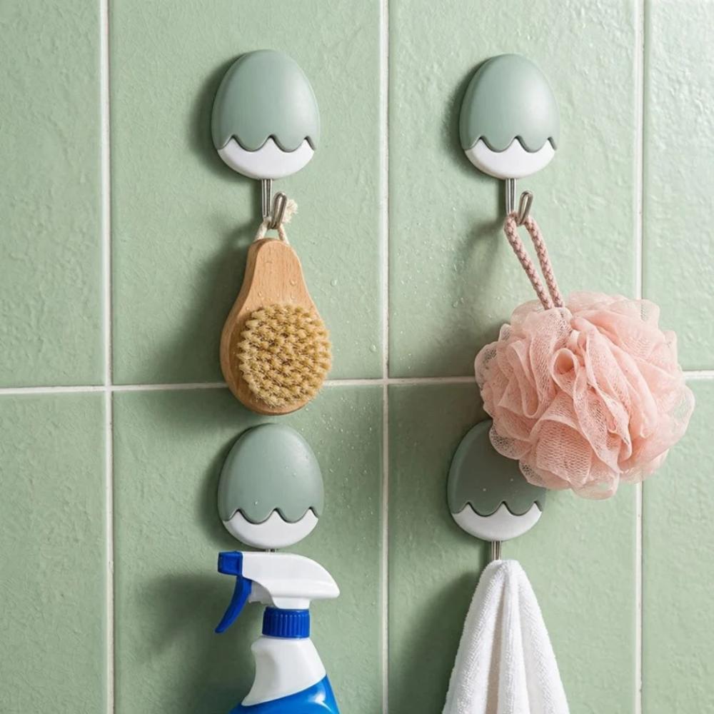 Egg Shape Sticky Wall Hooks, strong adhesive hooks for bags, keys, and accessories in Pakistan homes