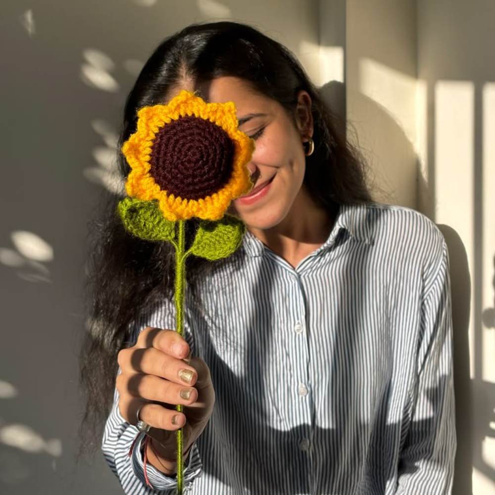 Handmade Crochet Sunflower Bouquet with Black Wrapping in Pakistan, soft yellow flowers with elegant black paper wrap.