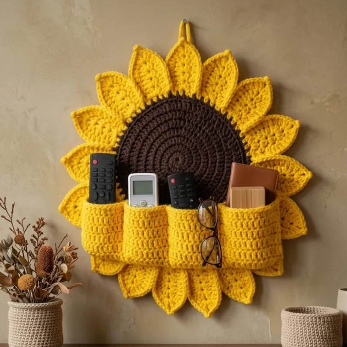 Handmade crochet sunflower wall organizer with storage pockets for keys, remote, and glasses in Pakistan