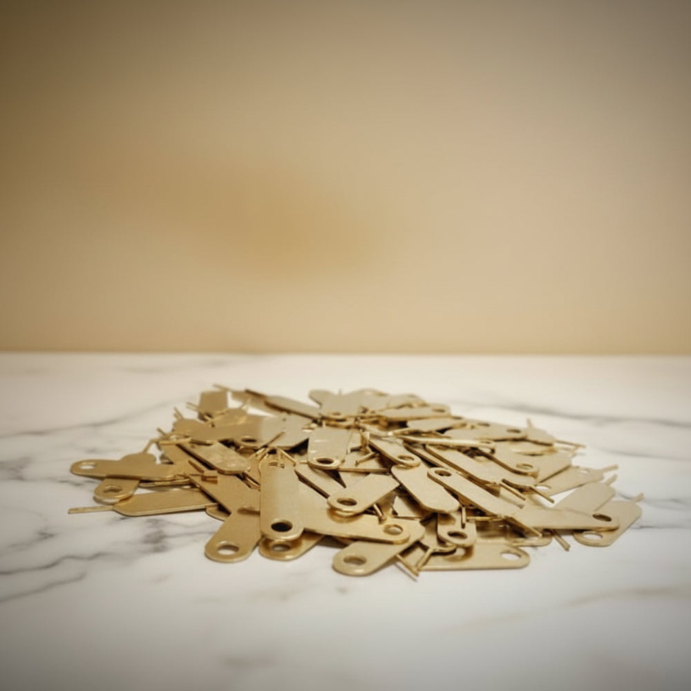 SIM ejector pin tool in use to remove mobile SIM card tray