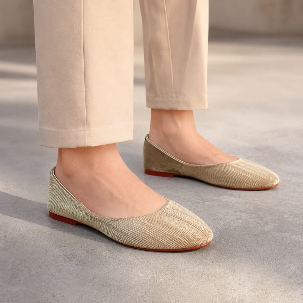 Women's beige pointed toe flat shoes with a soft textured upper, cushioned insole, and lightweight design for daily wear.