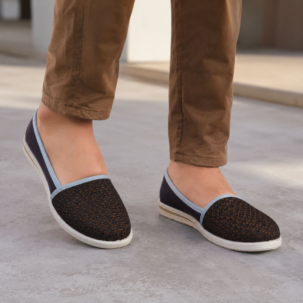 Women's brown slip-on flat shoes with a textured upper, soft insole, and lightweight sole for comfortable everyday wear.