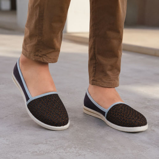 Women's brown slip-on flat shoes with a textured upper, soft insole, and lightweight sole for comfortable everyday wear.